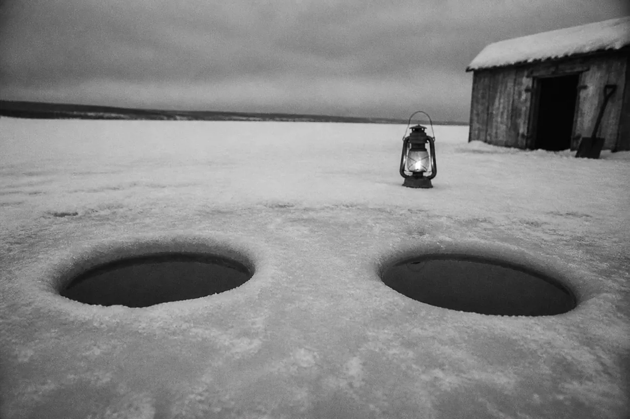 Row of Ice Fish tables, only one winch holding a real fish