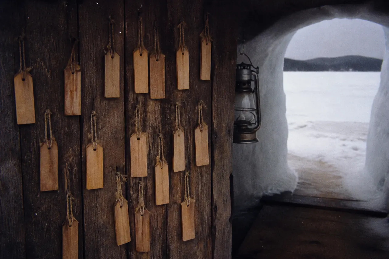 Ice tags hanging over the Ice Fish hole, no readable words